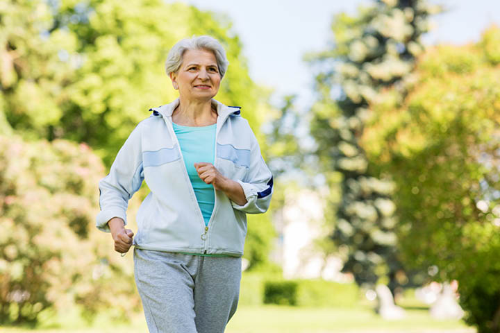 woman senior citizen walking outside